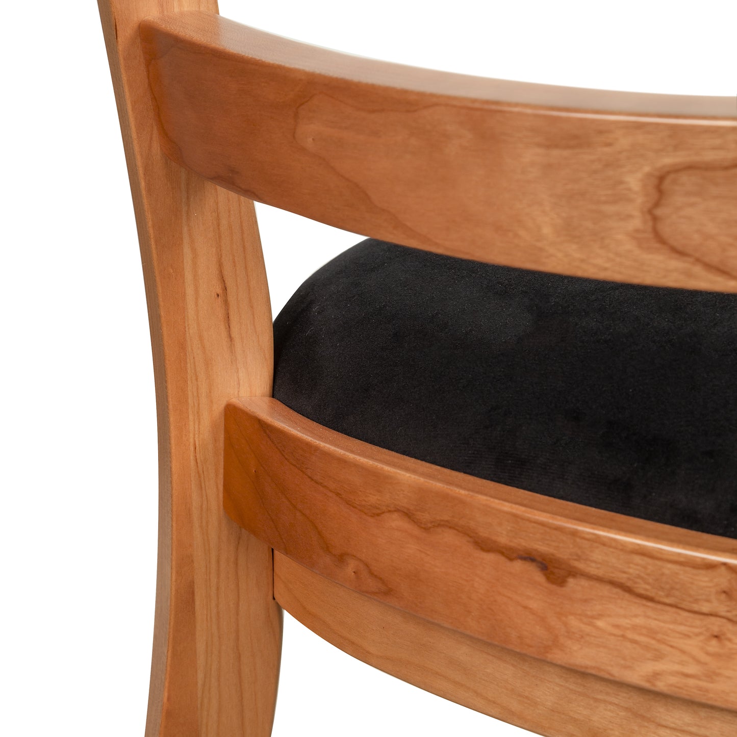 Bromley Ladder-Back Chair by Vermont Woods Studios, highlighting black upholstery and handcrafted details, American made quality furniture.