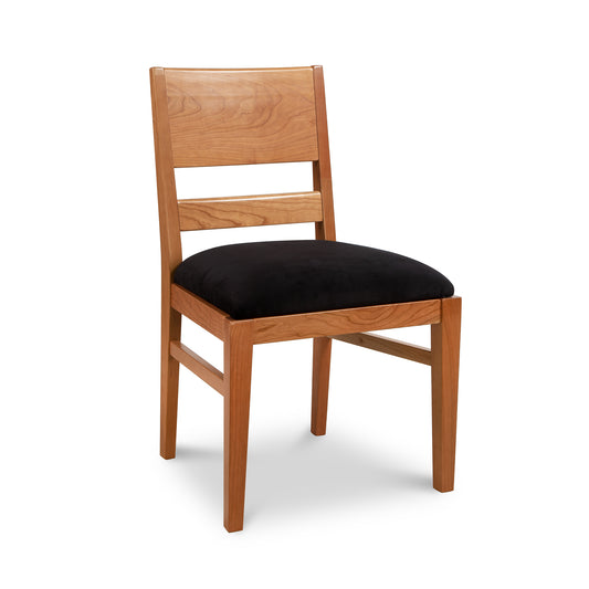 Burke Modern Chair by Vermont Woods Studios with black upholstery and Scandinavian-inspired design, showcasing expert American craftmanship.