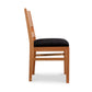 Burke Modern Chair by Vermont Woods Studios, side view, featuring black upholstery, straight backrest, and sleek Scandinavian-inspired design.