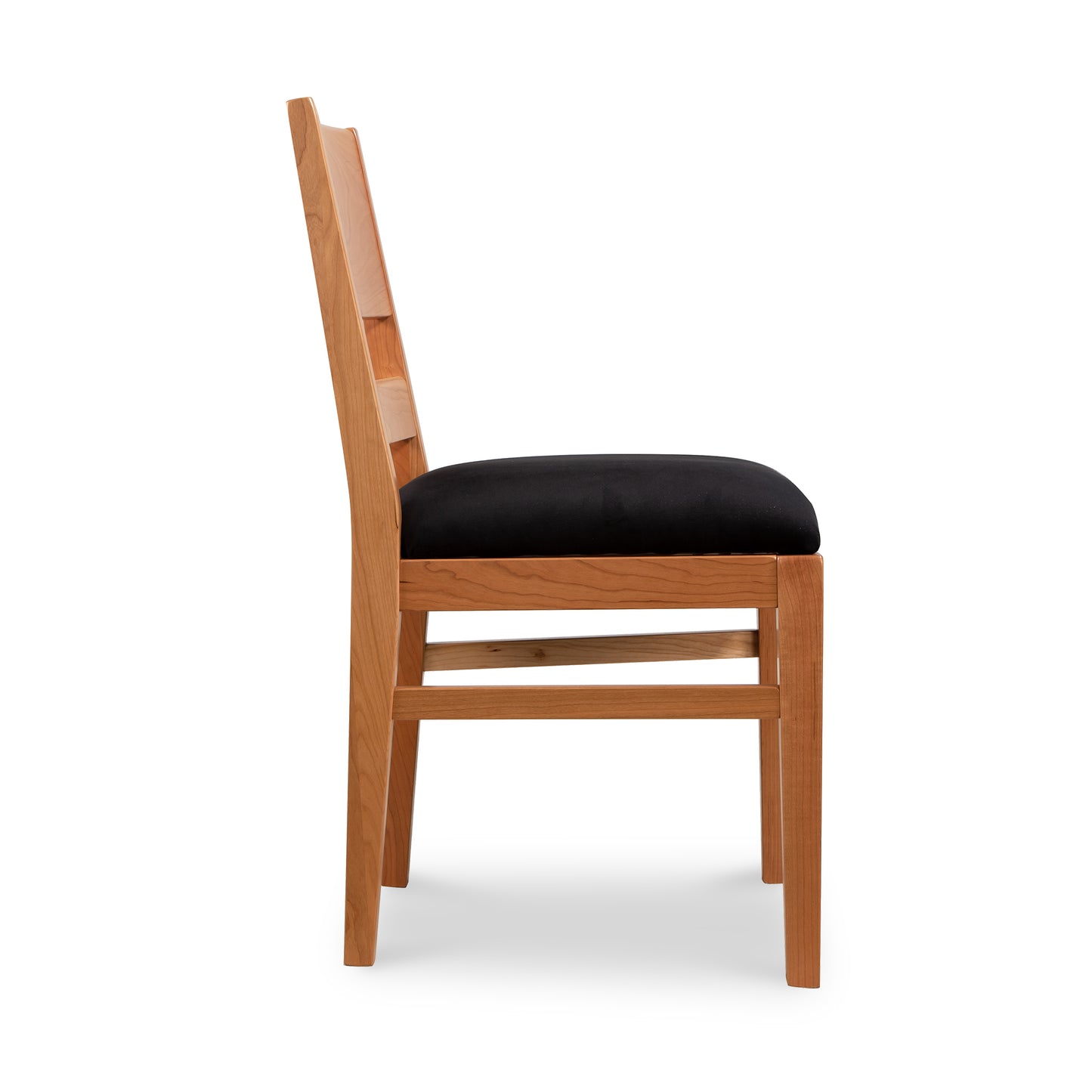 Burke Modern Chair by Vermont Woods Studios, side view, featuring black upholstery, straight backrest, and sleek Scandinavian-inspired design.