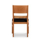 Burke Modern Chair by Vermont Woods Studios featuring sleek black upholstery and straight backrest, highlighted from the rear view.