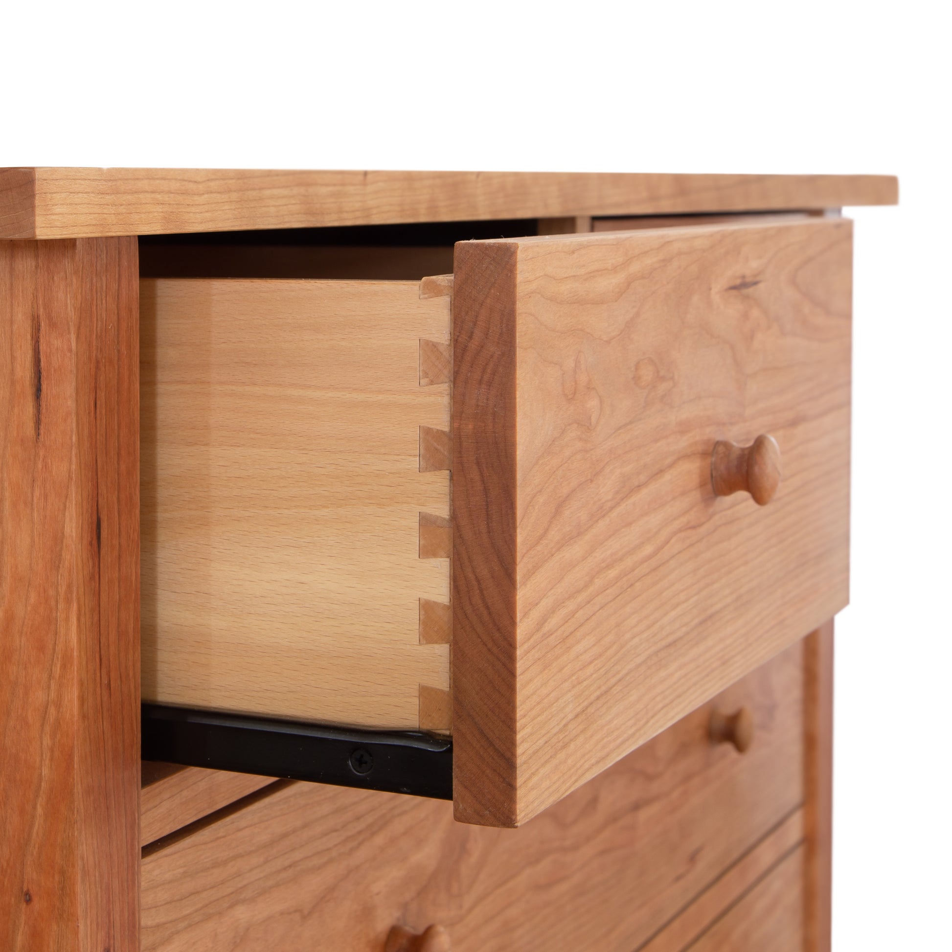 Heartwood Shaker 7-Drawer Chest by Vermont Furniture Designs, crafted in solid wood with visible dovetail joinery on the open top drawer.