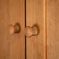 Burlington Shaker Tall Storage Chest by Vermont Furniture Designs, highlighting natural wood grain and round knobs on the doors.