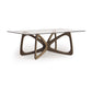 Butterfly Glass Top Dining Table by Copeland Furniture with sculptural hardwood base and clear rectangular glass top, showcasing contemporary craftsmanship.