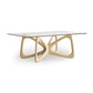 Butterfly Glass Top Dining Table by Copeland Furniture showcasing a sculptural hardwood base with elegant intersecting curves and clear glass top.