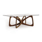 Copeland Butterfly Glass Top Dining Table with sculptural hardwood base, showcasing contemporary American craftsmanship.