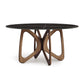 Butterfly Round Table by Copeland Furniture with eco-friendly dark sintered stone top and sculptural hardwood base.