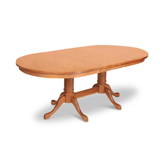 Lyndon Furniture Cabriole Double Pedestal Extension Dining Table with oval top and elegant curved legs in light brown wood finish.