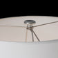 Hubbardton Forge Cairn Floor Lamp featuring a handcrafted white shade, elegant metal spokes, and a round silver finial, American made quality.
