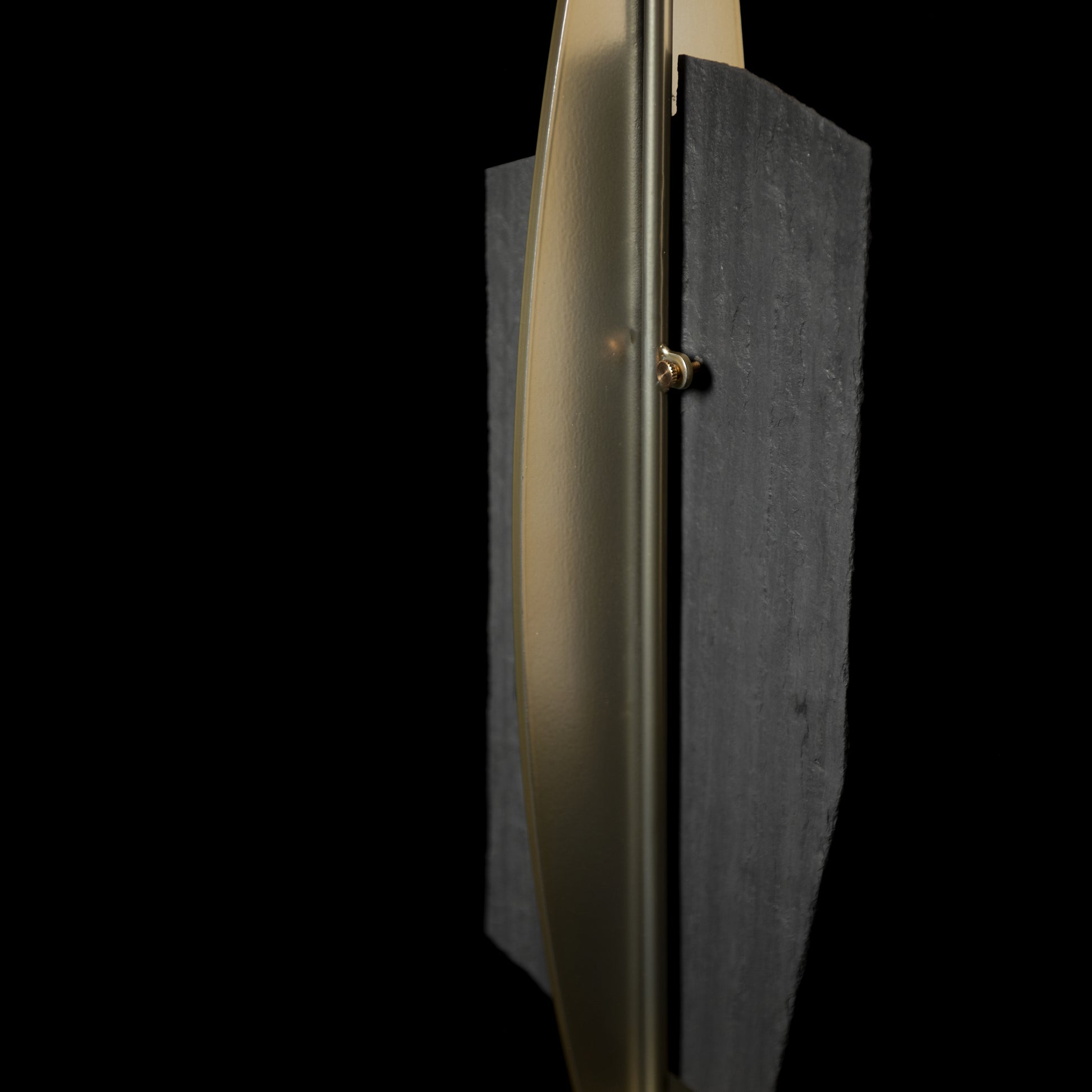 Cambrian Table Lamp by Hubbardton Forge featuring a vertical gold pole and dual Vermont black slate steel panels.