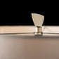 Steel finial detail on Cambrian Table Lamp by Hubbardton Forge, emphasizing sleek craftsmanship and elegant design.
