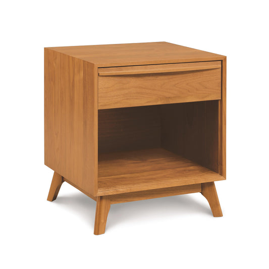 Catalina Nightstand by Copeland Furniture featuring a solid wood construction, open shelf, drawer, and angled legs showcasing modern design.