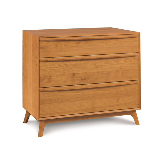 Copeland Furniture Catalina 3-Drawer Chest featuring sustainably harvested wood, a natural finish, and modern angled legs.
