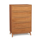 Catalina 5-Drawer Wide Chest by Copeland Furniture, featuring a light finish and distinctive angled legs in mid-century modern design.