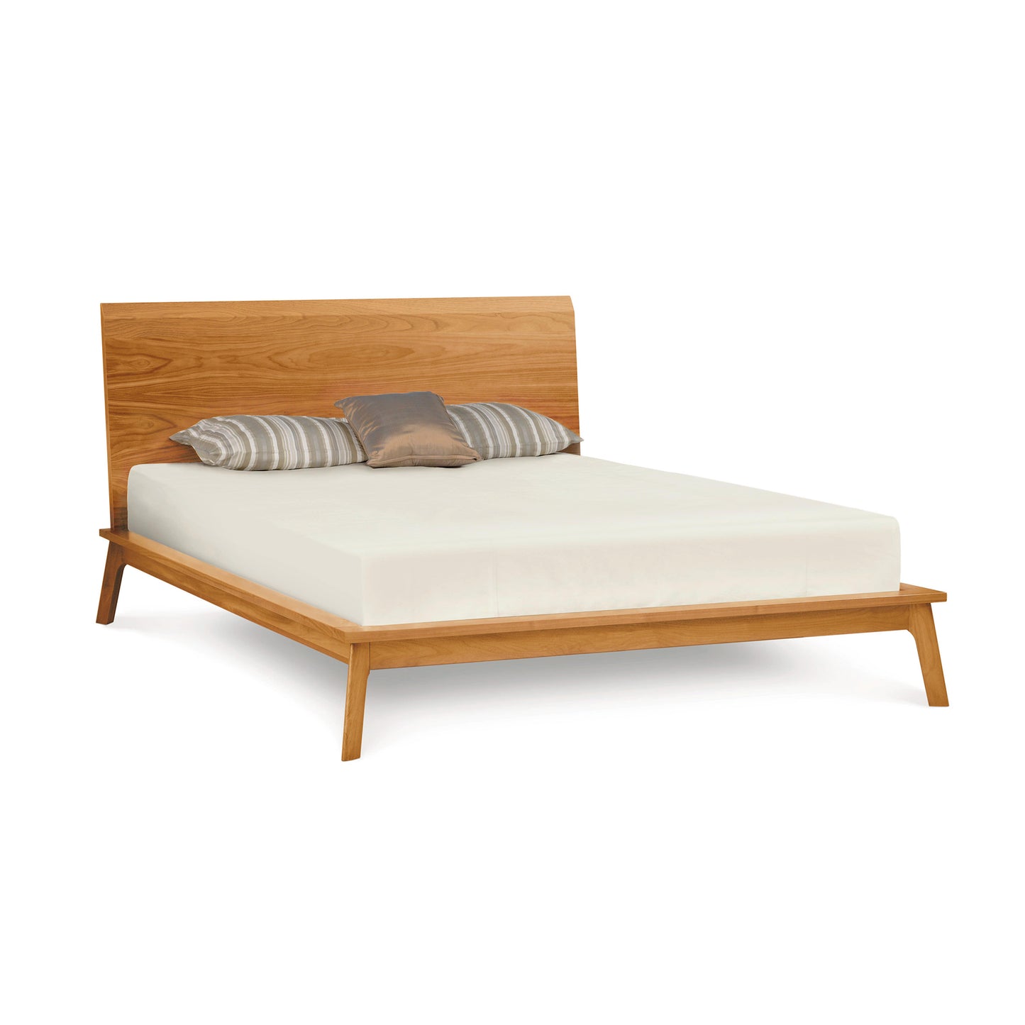 Catalina Platform Bed by Copeland Furniture; sustainable wood, elegant slanted headboard with striped pillows.