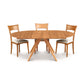 Copeland Catalina Round Extension Table with angled legs and three cushioned chairs, highlighting the modern wood furniture design.