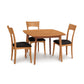 Copeland Catalina dining set with solid-top table and black cushioned chairs, showcasing fine craftsmanship and elegant design.