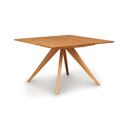 Copeland Furniture Catalina Square Extension Dining Table with mid-century design and four angled, center-joining legs, crafted from solid wood.