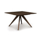 Catalina Square Extension Dining Table by Copeland Furniture with mid-century design, dark wood finish, and distinctive angled center legs.