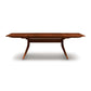 Catalina Trestle Extension Table by Copeland Furniture, showcasing angled legs and a smooth solid American hardwood top.