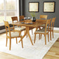 Copeland Furniture Ingrid Chairs surrounding a solid wood dining table, showcasing fine craftsmanship and elegant design.