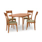 Copeland Furniture Catalina Drop-Leaf Dining Table set featuring a solid wood table and four green upholstered chairs, American made quality.