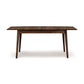 Copeland Furniture Catalina Extension Table shown in dark brown solid wood, featuring a sleek Mid-Century design with four legs.
