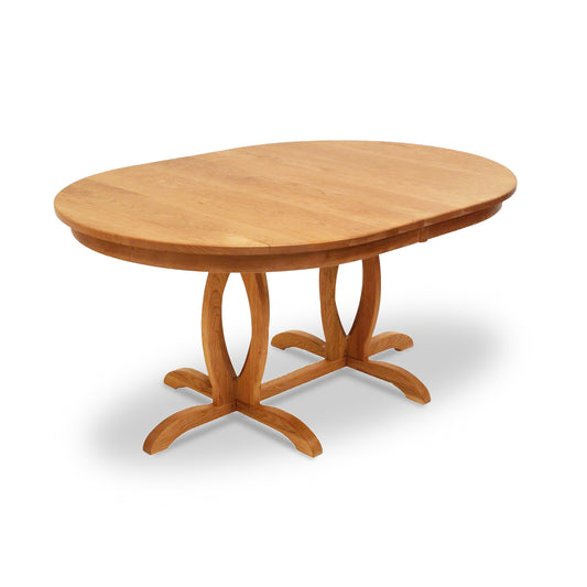 Lyndon Furniture Cherry Blossom Double Pedestal Extension Table with oval top and light brown finish, featuring a classic double pedestal base.