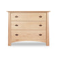 Cherry Moon 3-Drawer Chest by Maple Corner Woodworks highlighting its rich hardwood craftsmanship and three drawers with semicircular metal handles.