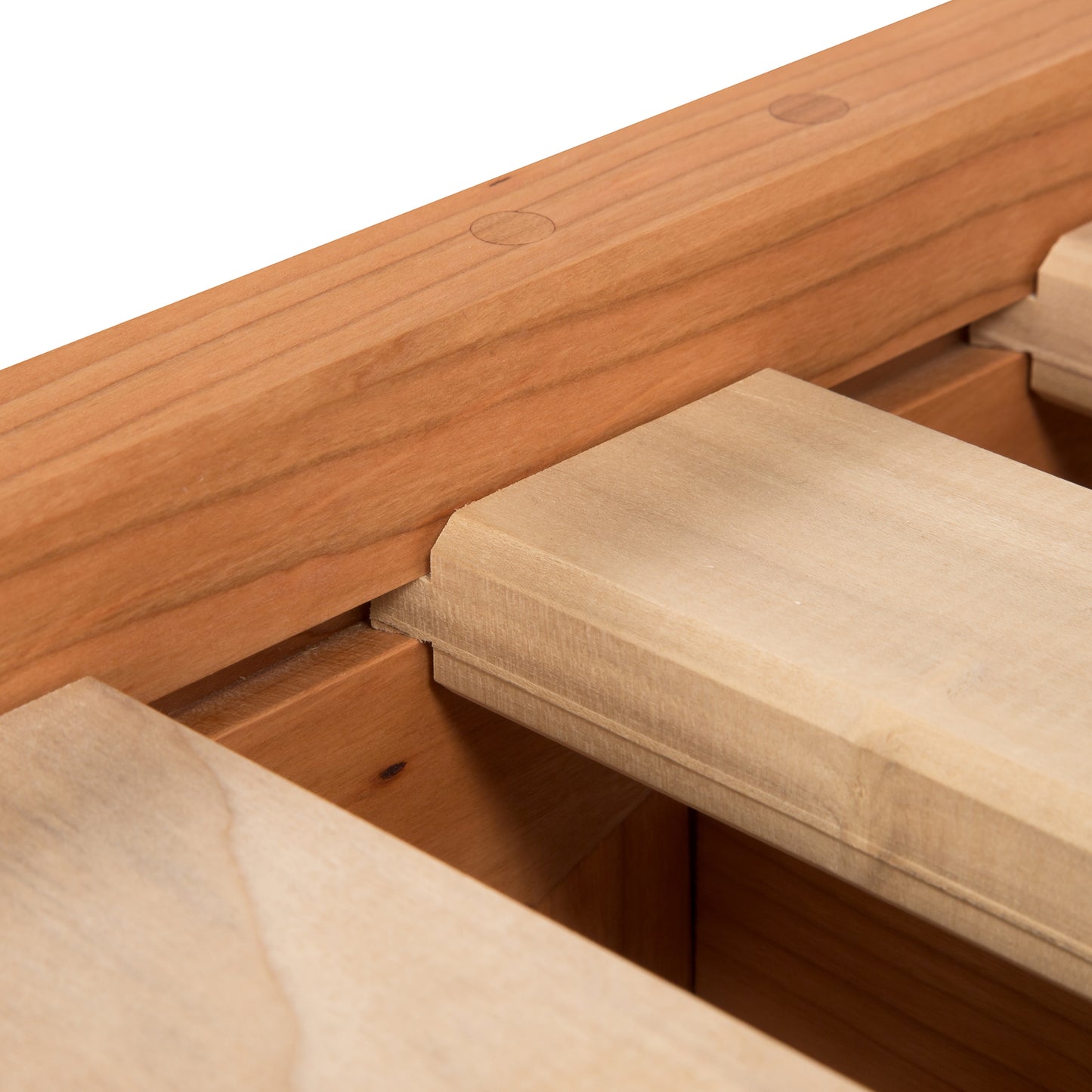 Cherry Moon Dovetail Platform Bed by Maple Corner Woodworks showcasing detailed wood grain and dovetail joints, crafted from sustainably harvested cherry wood with an eco-friendly oil finish.