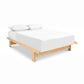 Cherry Moon Dovetail Platform Bed by Maple Corner Woodworks featuring a white mattress and pillows, showcasing expert Vermont craftsmanship.