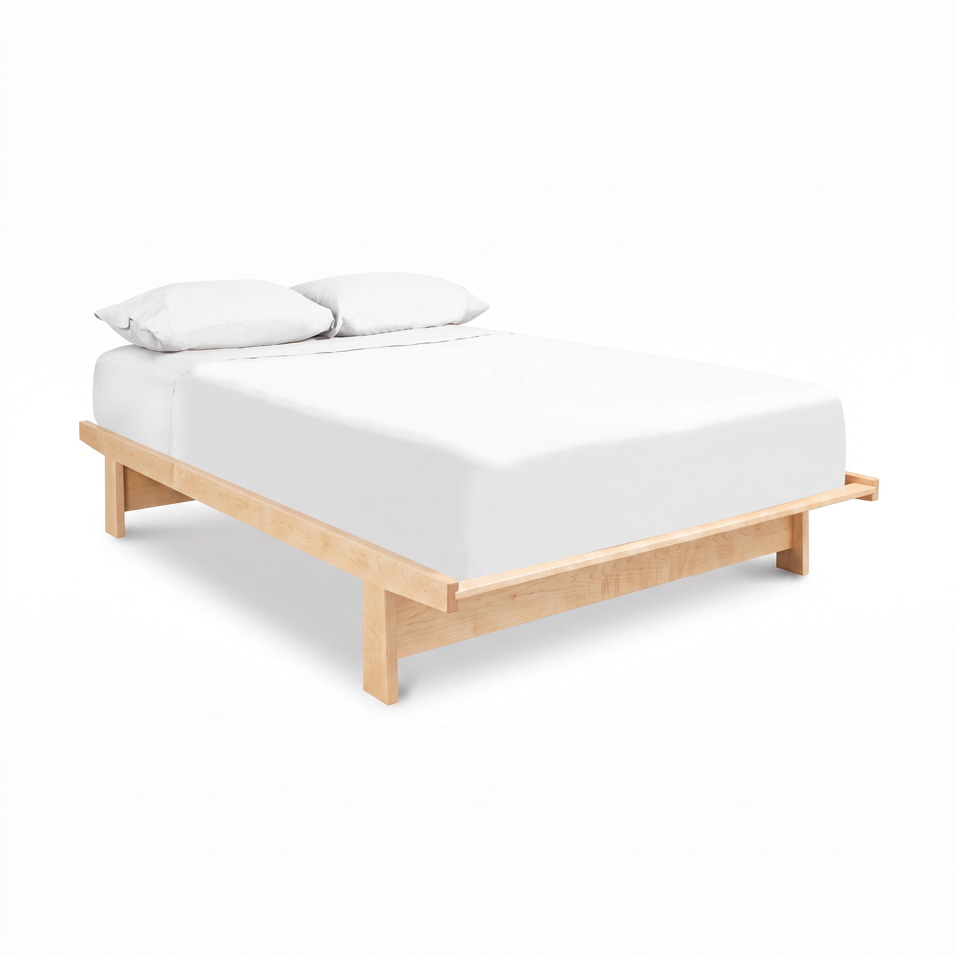 Cherry Moon Dovetail Platform Bed by Maple Corner Woodworks featuring a white mattress and pillows, showcasing expert Vermont craftsmanship.