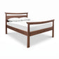 Cherry Moon Pagoda Bed by Maple Corner Woodworks with headboard, footboard, mattress, and two white pillows, crafted in solid wood.