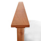 Detail view of the Cherry Moon Panel Bed by Maple Corner Woodworks, showcasing the handcrafted cherry wood corner and panel design.
