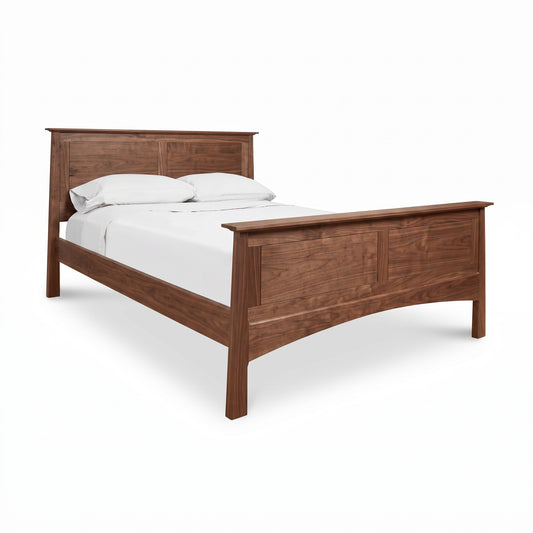 Maple Corner Woodworks Cherry Moon Panel Bed featuring a rectangular headboard, white bedding, and visible underbed storage.