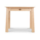 Cherry Moon Writing Desk by Maple Corner Woodworks, handcrafted in Vermont with light wood, angled legs, and a center drawer.