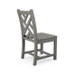 Gray POLYWOOD Chippendale Outdoor Dining Chair featuring a slatted seat and cross-back design, viewed from behind at an angle.