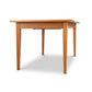 Classic Shaker Butterfly Extension Table by Lyndon Furniture in solid wood, viewed from a low angle, highlighting craftsmanship and design.