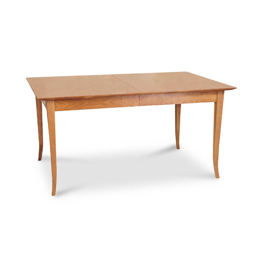 Lyndon Furniture Classic Shaker Flare Leg Extension Dining Table with rectangular wood top and four elegant, curved shaker-style legs.