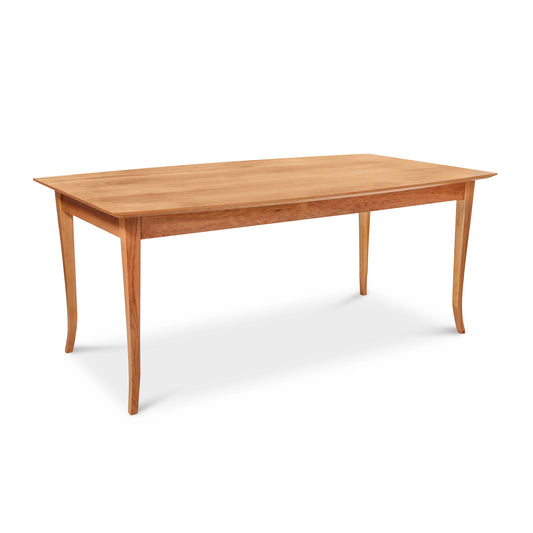 Lyndon Furniture Classic Shaker Flare Leg Table with a solid boat-shaped rectangular top and elegantly curved hardwood legs.