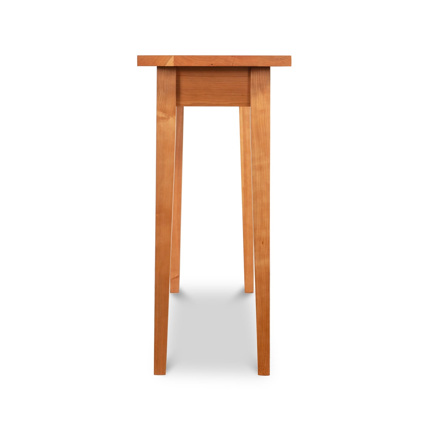 Lyndon Furniture Classic Shaker Sofa Table in natural cherry with tapered legs, viewed from the narrow side.
