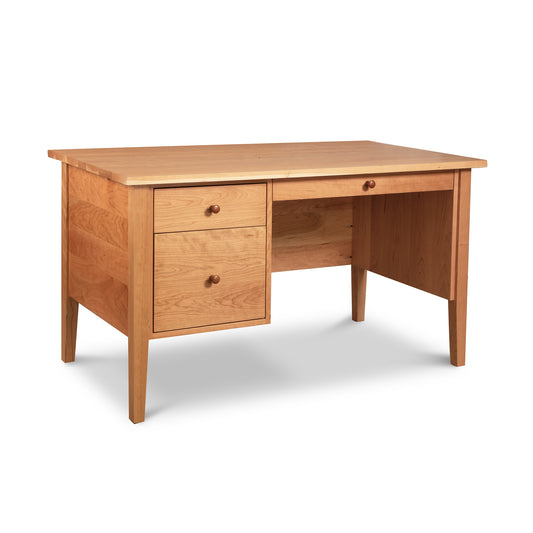 Lyndon Furniture Small Wood Executive Desk with two left drawers, open right knee space, and classic Shaker-style solid wood legs.
