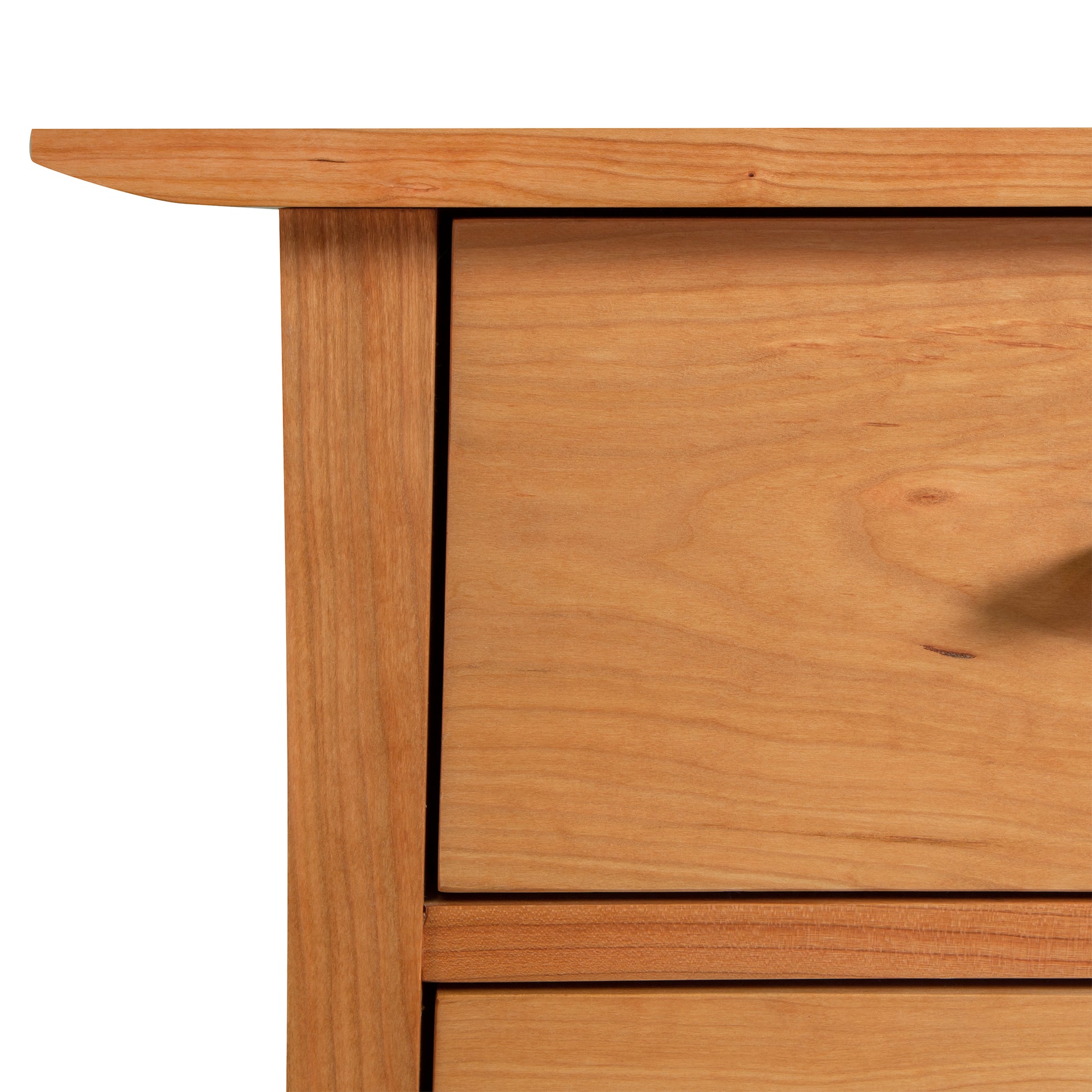 Detail of the top left corner of the Contemporary Craftsman 5-Drawer Chest by Vermont Furniture Designs, highlighting wood grain and eco-friendly oil finish.