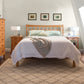 Pierce platform bed by Vermont Furniture Designs with right siderail and white bedding, showcased with matching nightstands.
