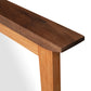 Contemporary Craftsman Mirror by Vermont Furniture Designs with a dark brown top edge and lighter wood sides, highlighting premium craftsmanship.