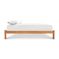 Contemporary Craftsman Platform Bed crafted from sustainable hardwood by Vermont Furniture Designs, showcasing its elegant simplicity with a white mattress and pillow.