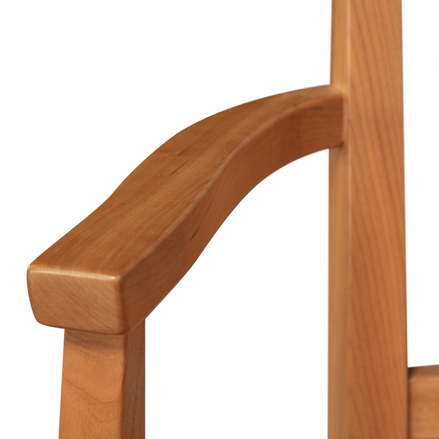 Contemporary Shaker Chair armrest by Vermont Woods Studios, showcasing smooth natural wood grain and a sustainably handcrafted curved design.