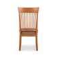 Contemporary Shaker Side Chair by Vermont Woods Studios with vertical slats and barley-colored fabric seat upholstery, floor model.