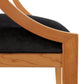Dorset Chair by Vermont Woods Studios with a curved wooden frame in Bank of England style and a black cushioned seat.