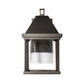 Dorset Small Dark Sky Friendly Outdoor Sconce by Hubbardton Forge, showcasing hand-forged steel and clear bubbled glass craftsmanship.